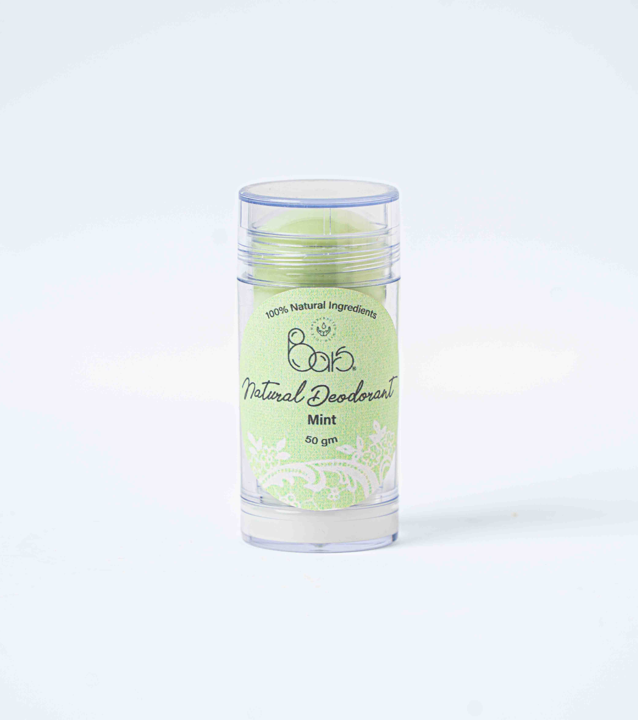 Natural deodorant stick with green label on a white background