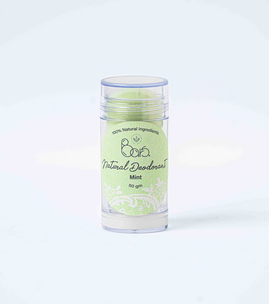 Natural deodorant stick with green label on a white background